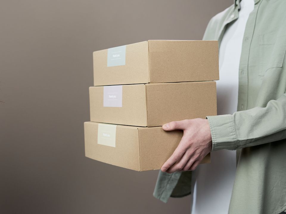 Plain unlabelled parcels being handed over
